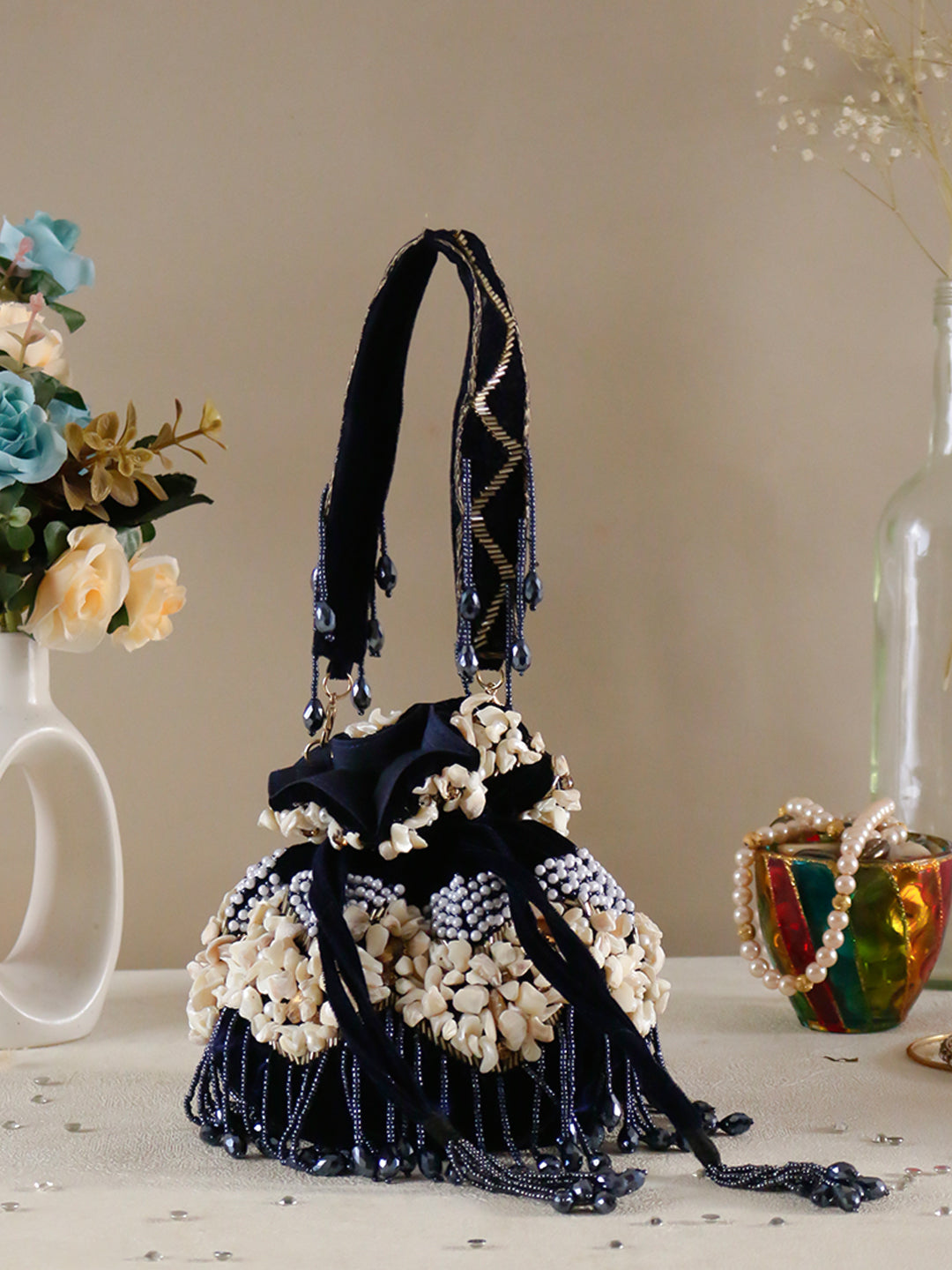 Swisni noorah velvet potli bag