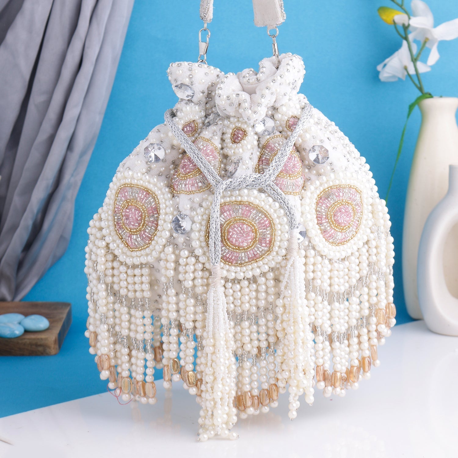 Swisni white pearl potli bag