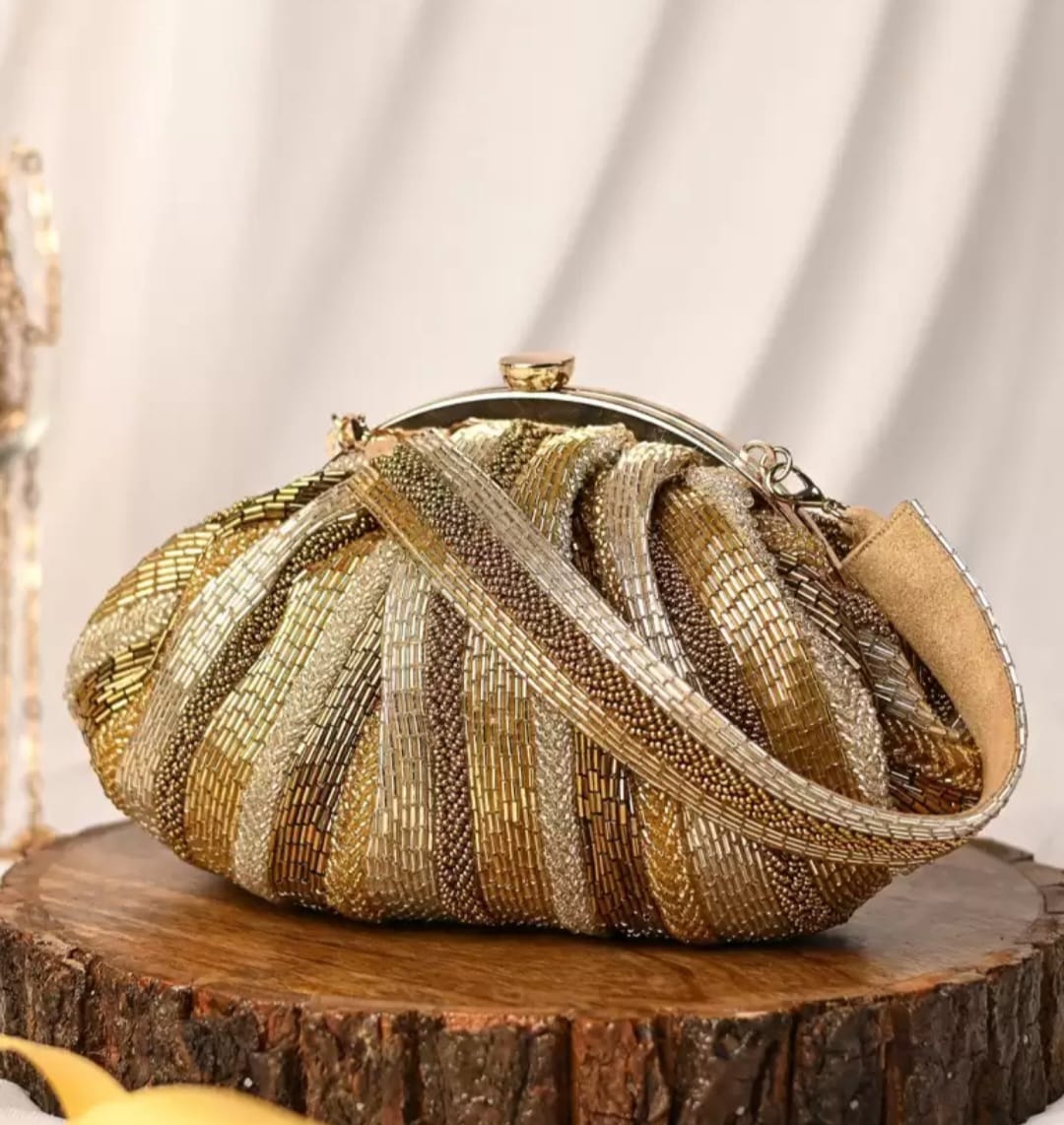 Golden antique batua bag
