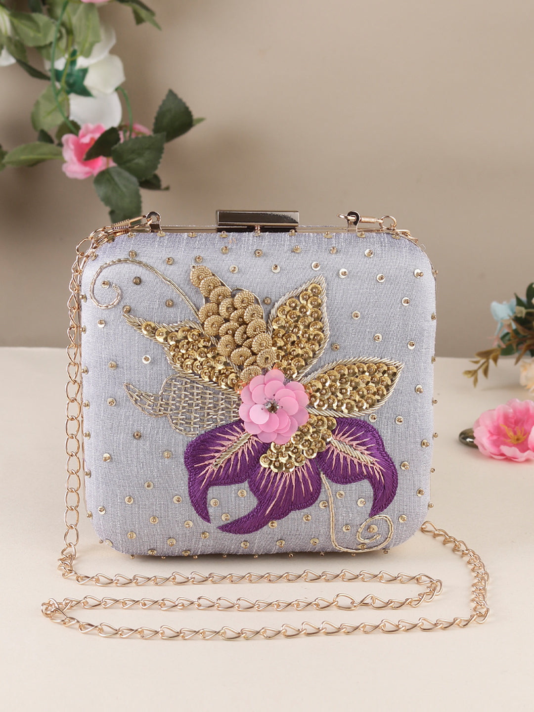 Swisni purple embroidered clutch bag