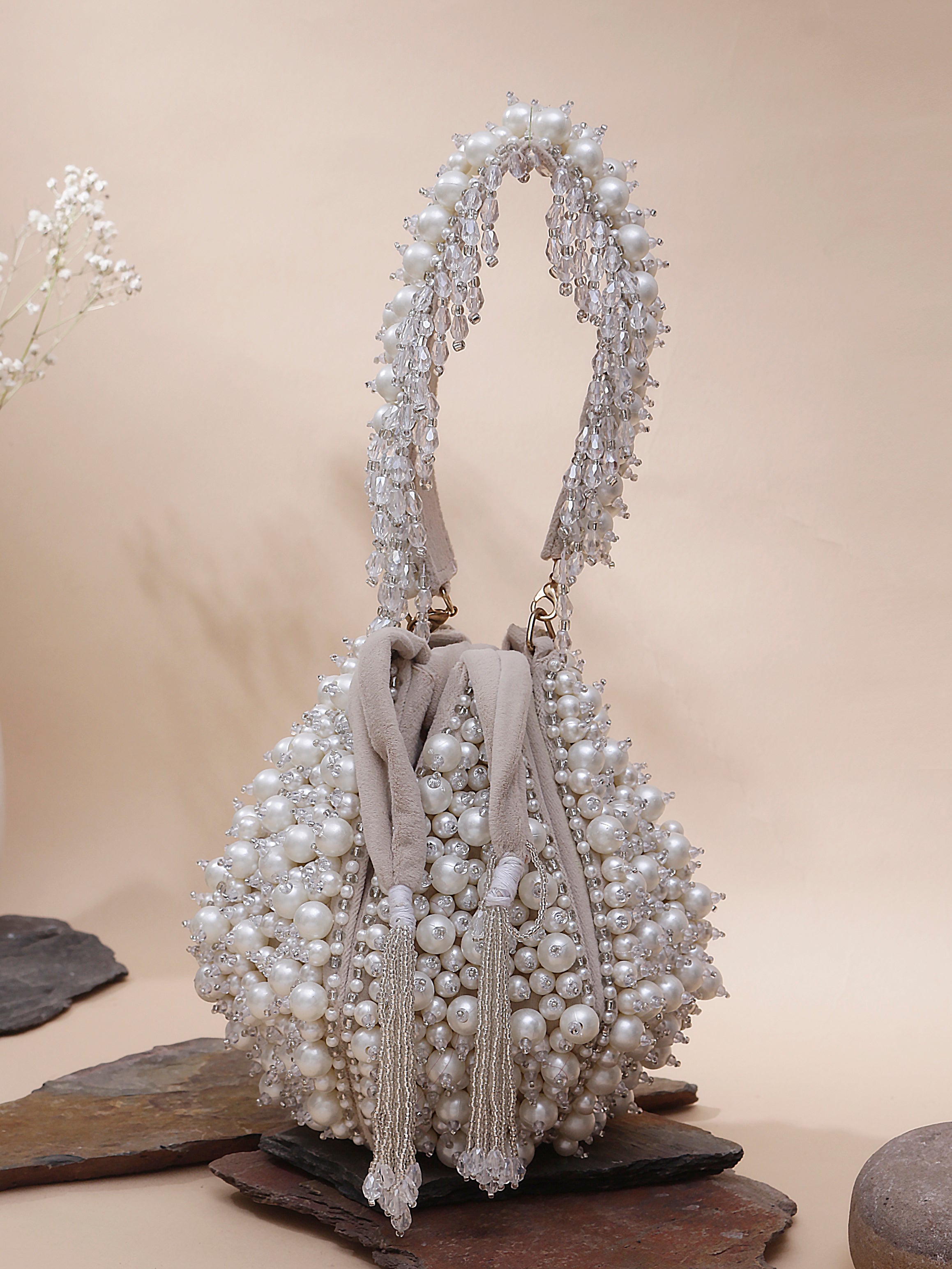 Swisni beige pearl anar potli bag