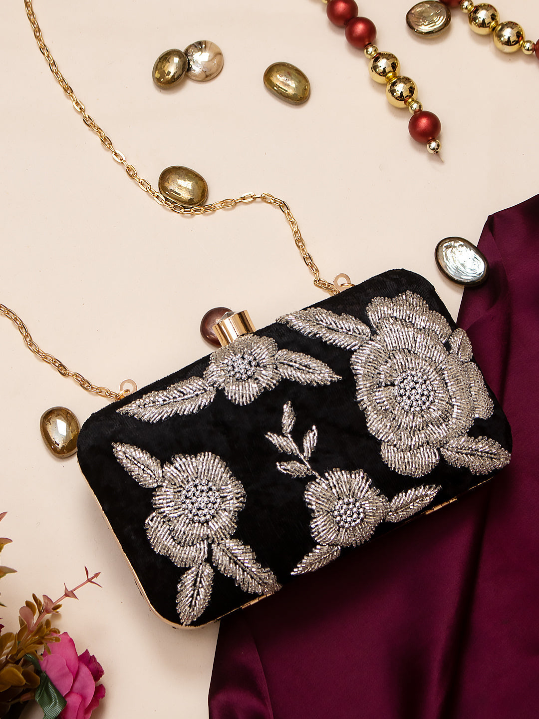 Silver embroidered black clutch