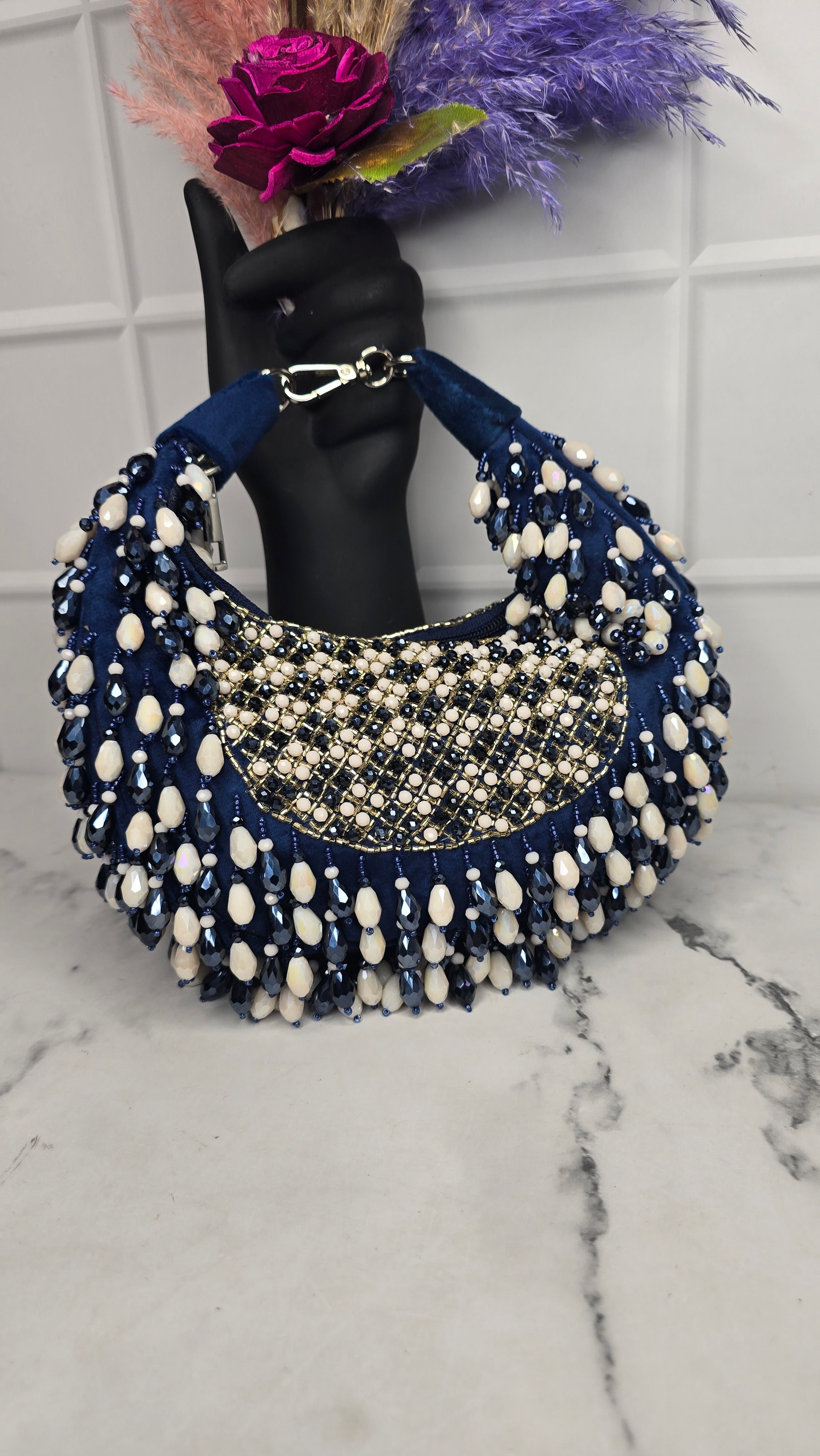 New Arohi moon clutch bag