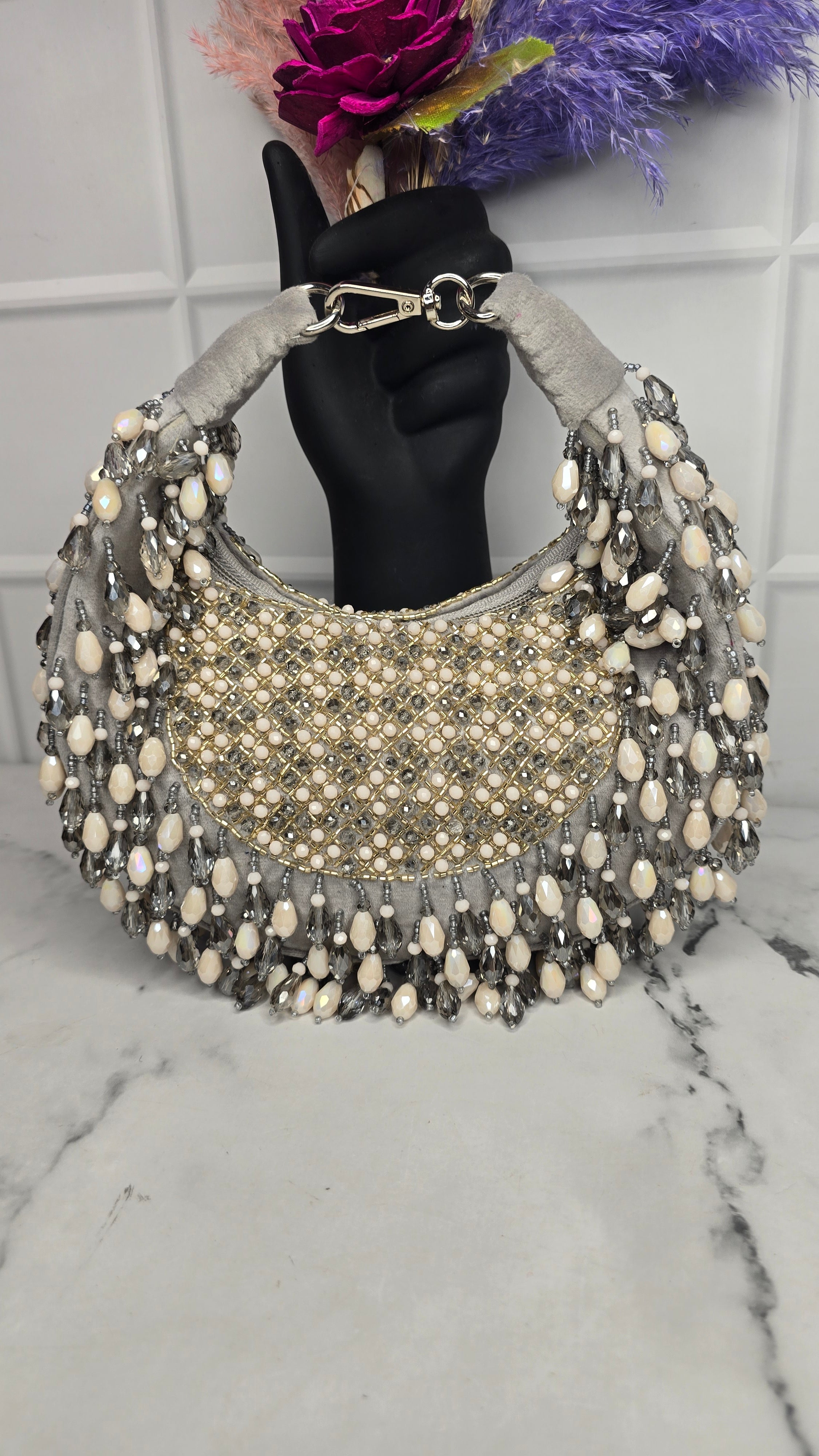 New Arohi moon clutch bag