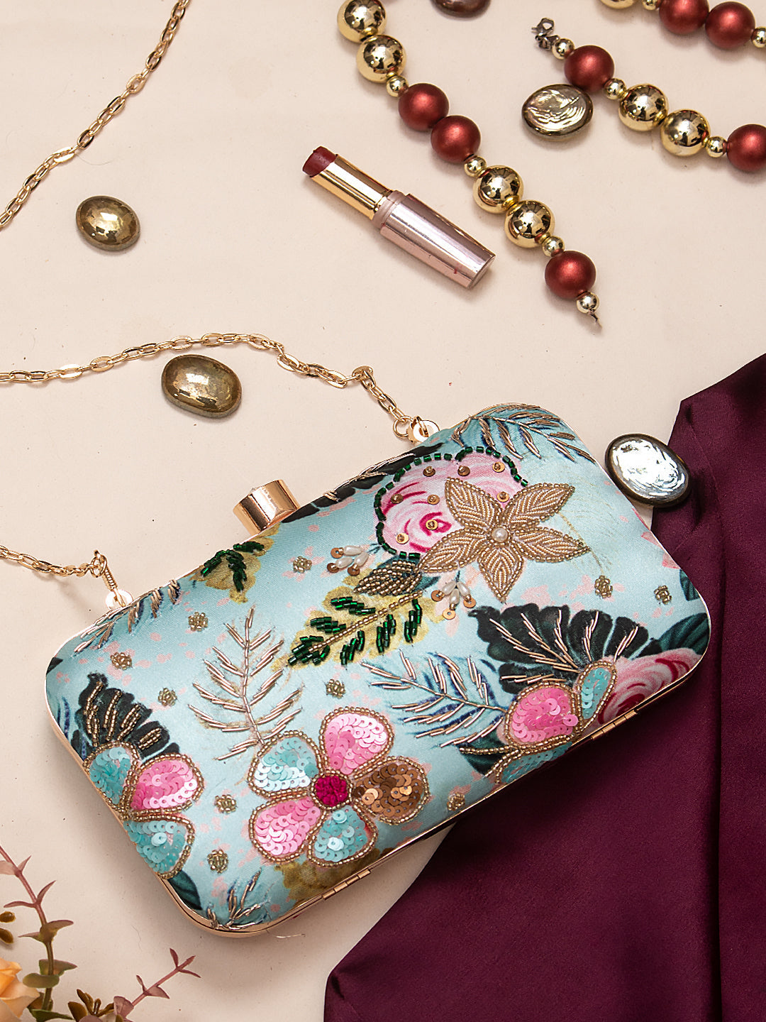Swisni green printed embroidered clutch