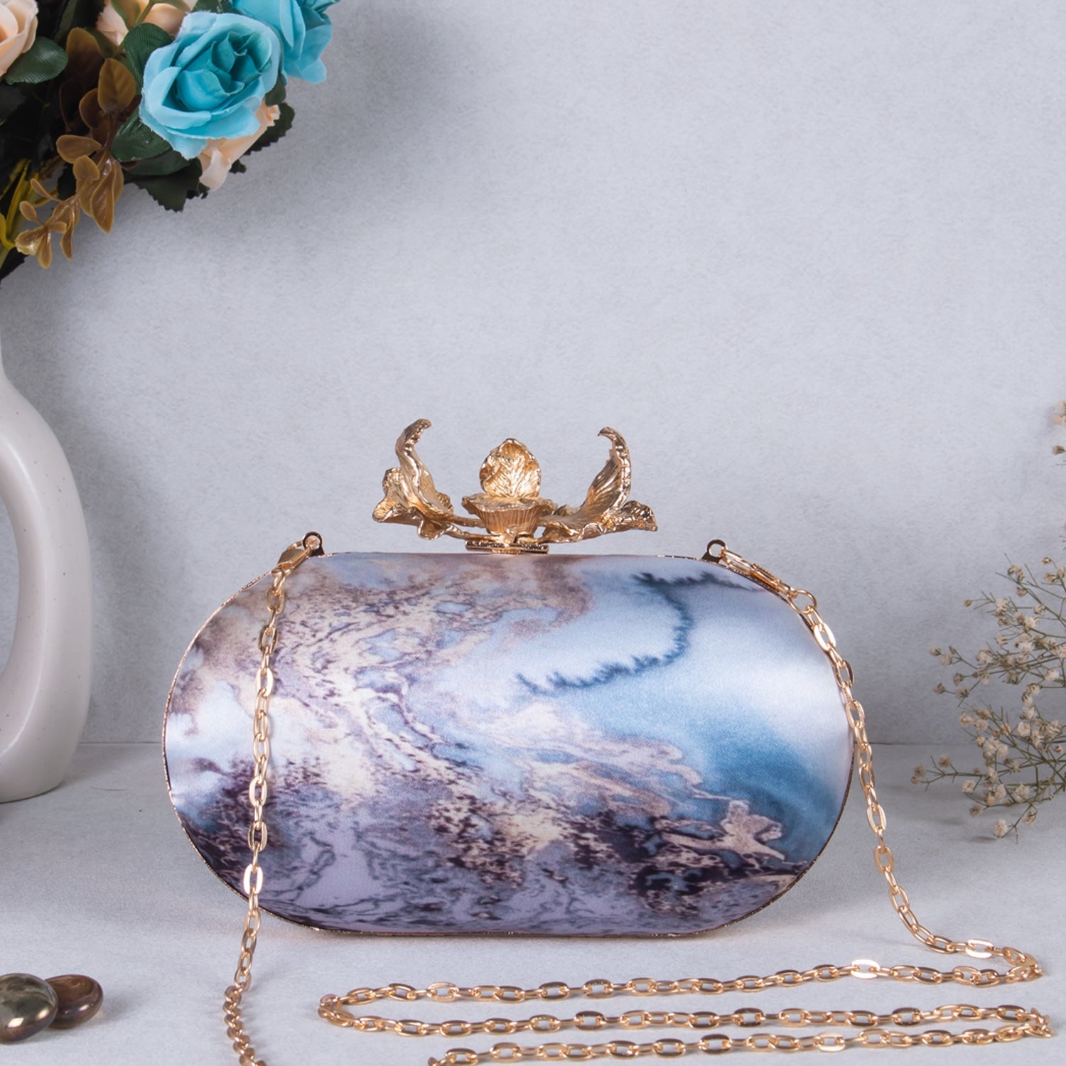 printed oval clutch