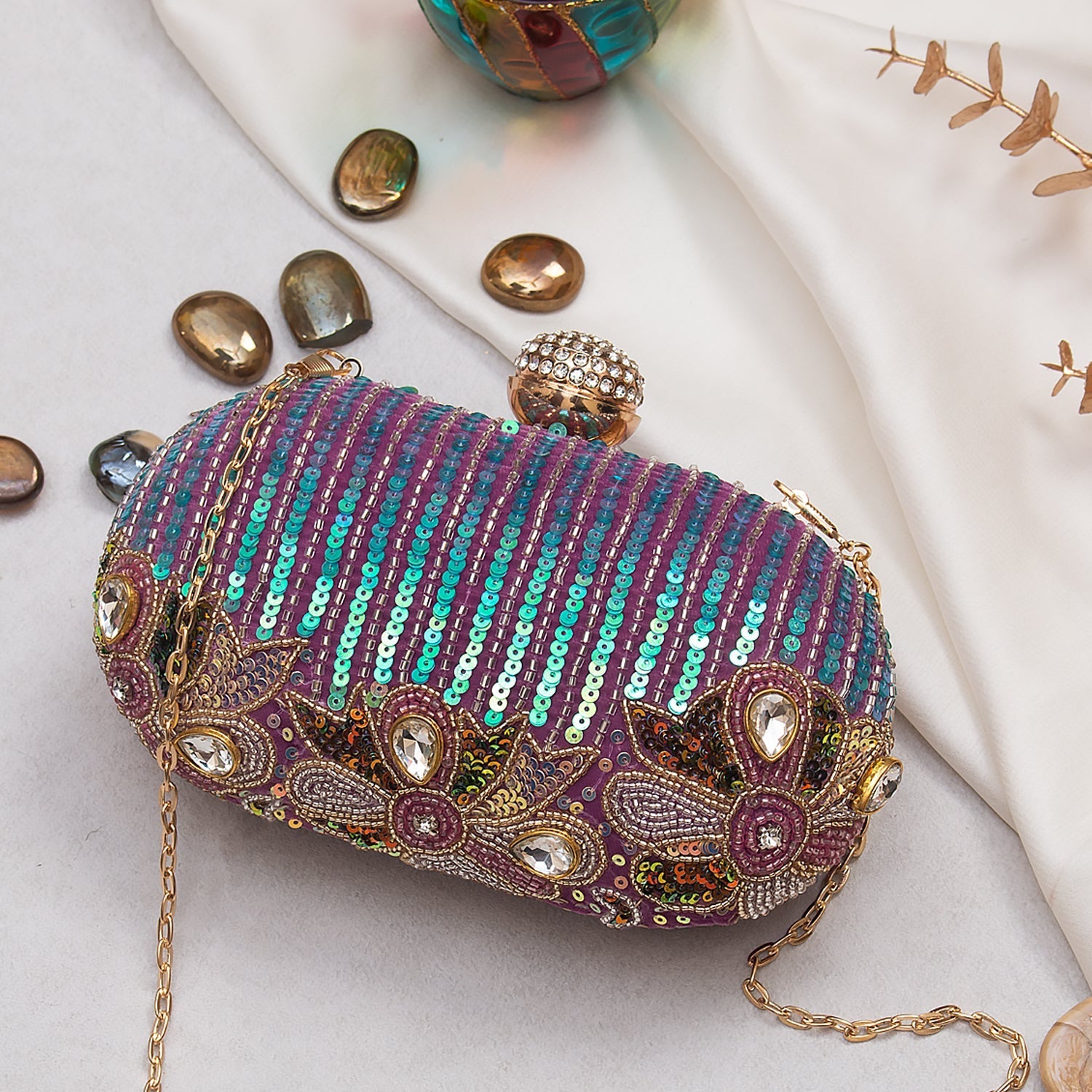 designer oval clutch