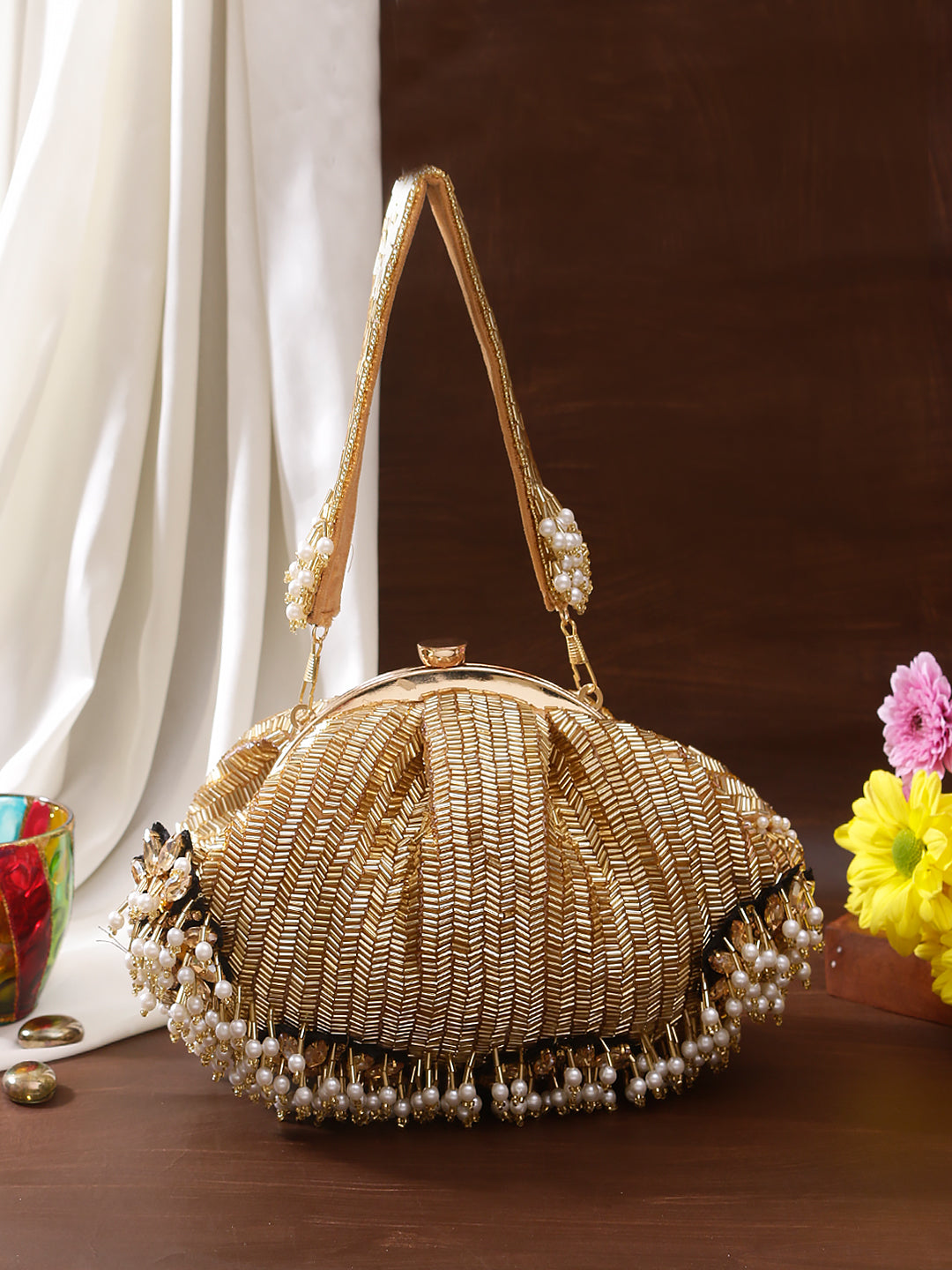 gold brooch designer batua clutch