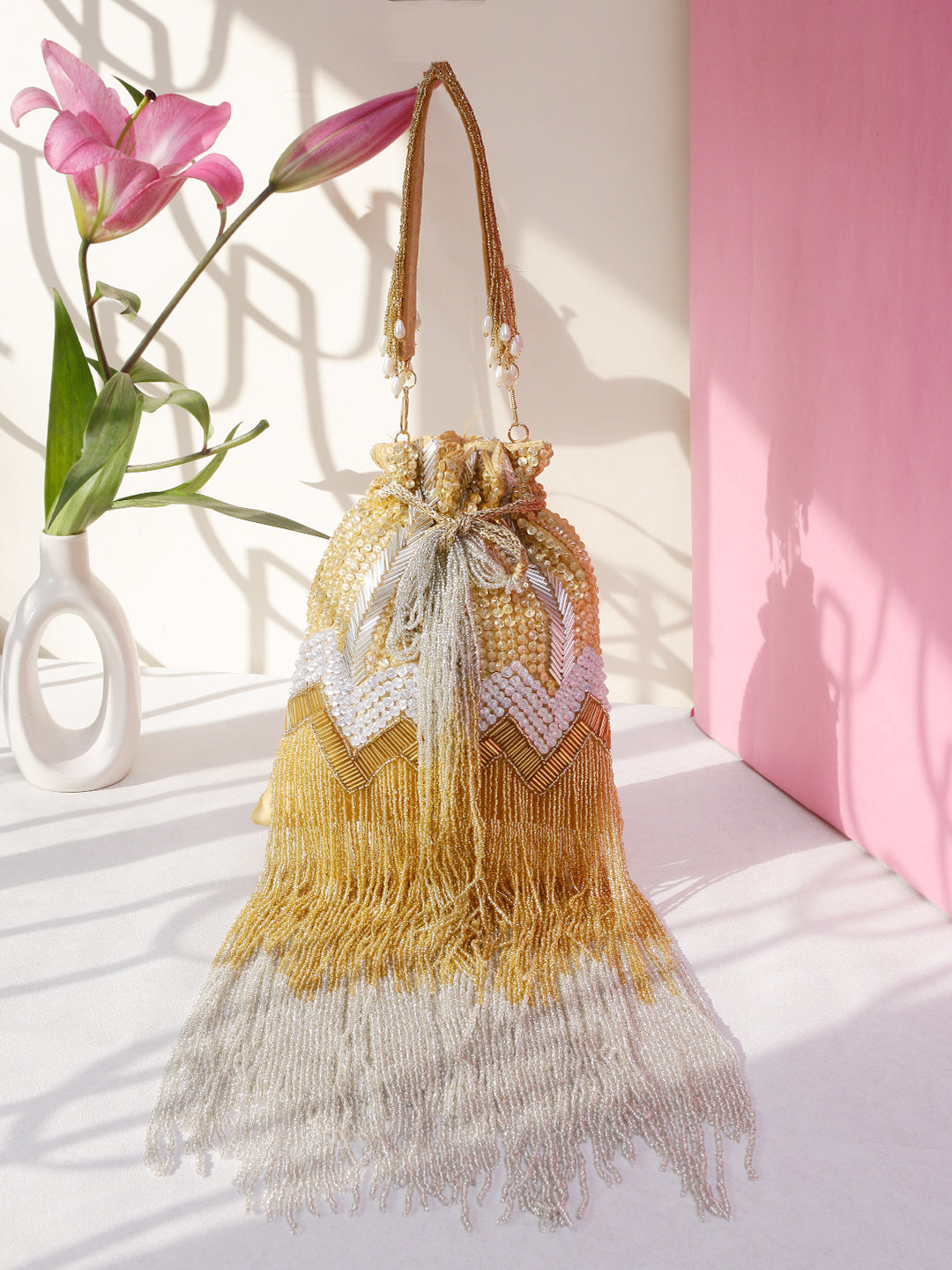 Swisni malaika golden potli bag