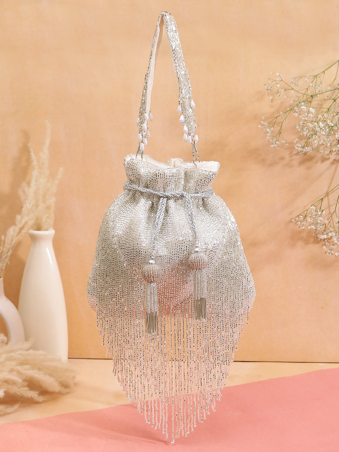 silver tassel potli