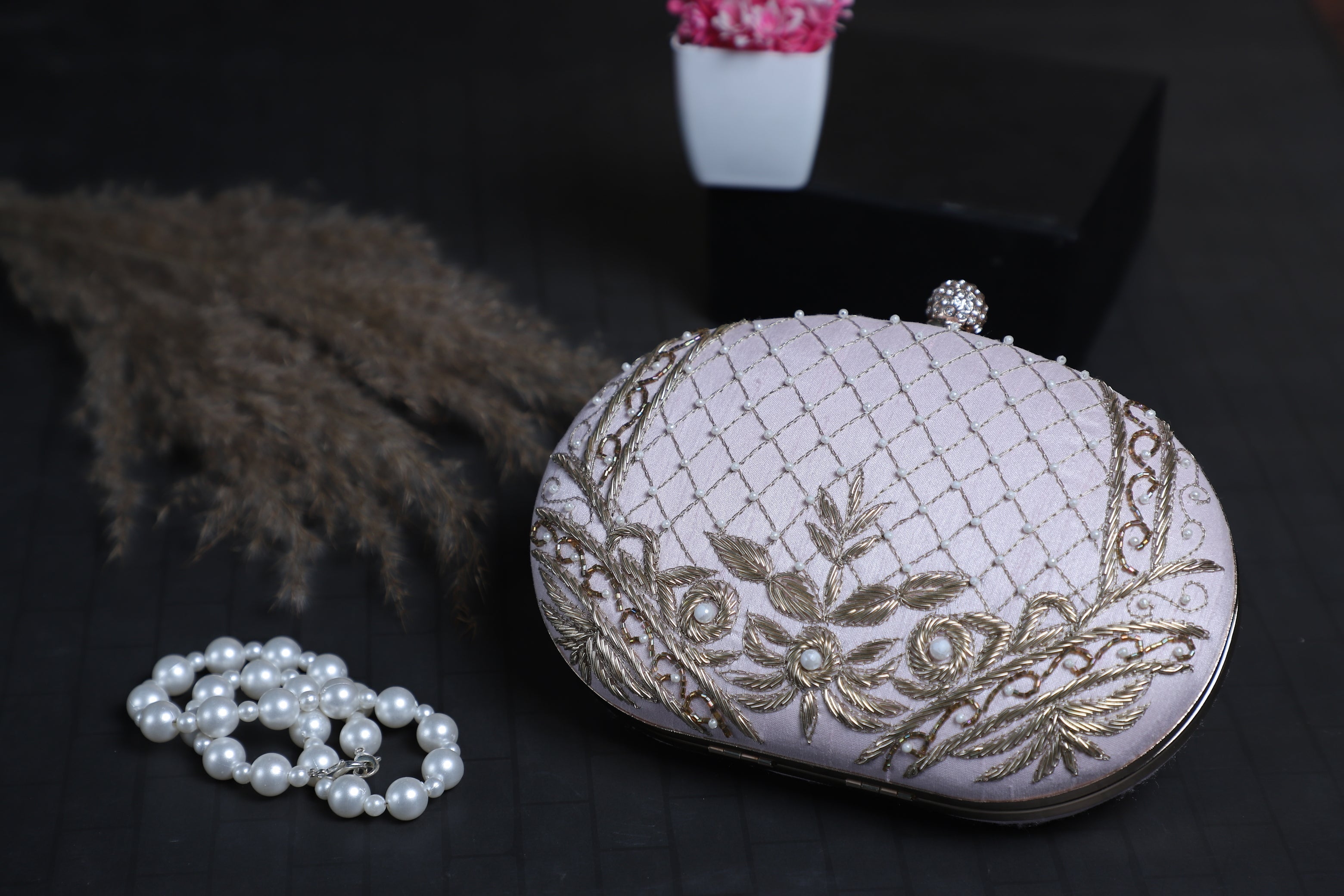 Baby pink oval dabka clutch bag