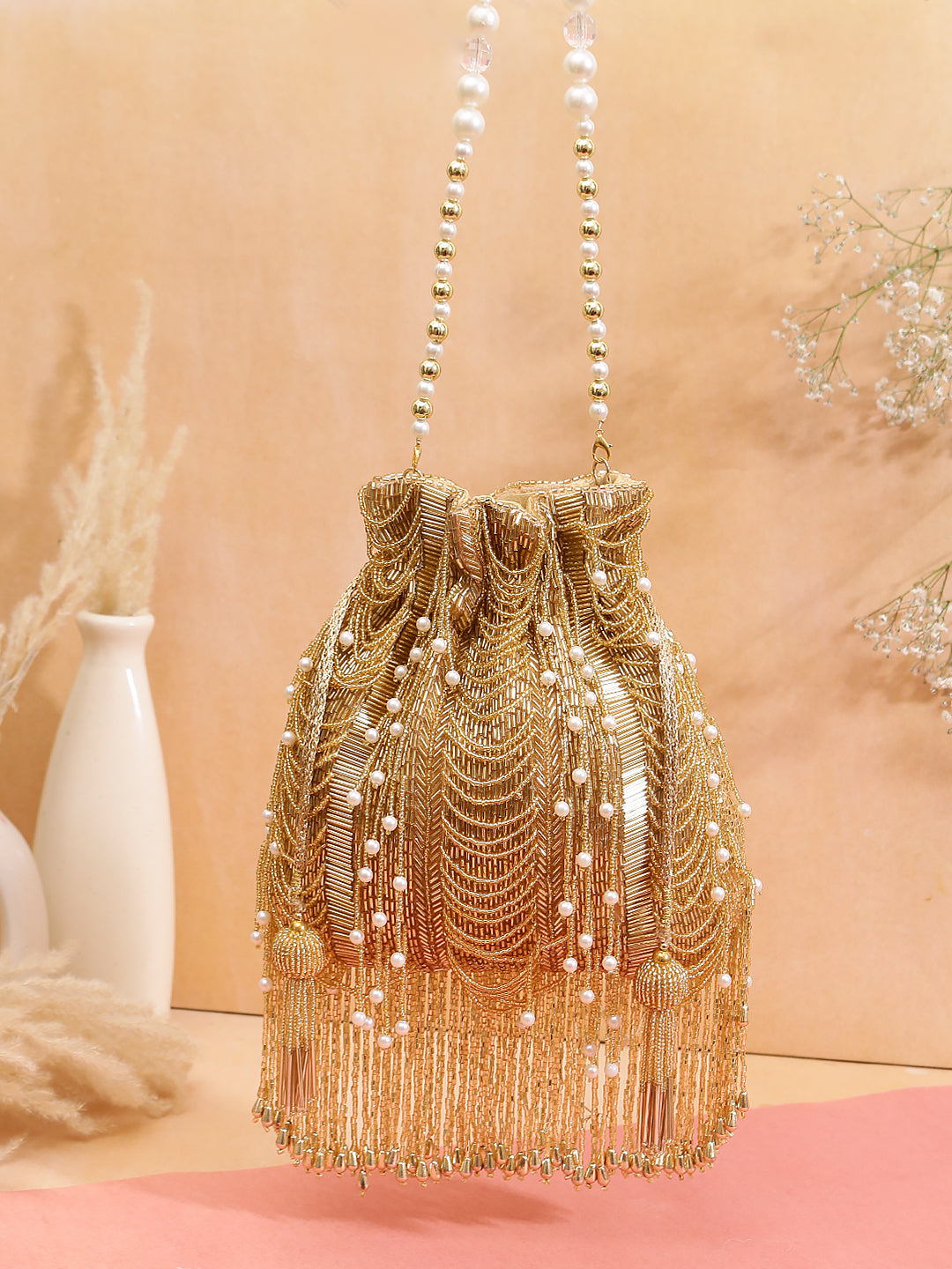 gold heavy fringes gold potli