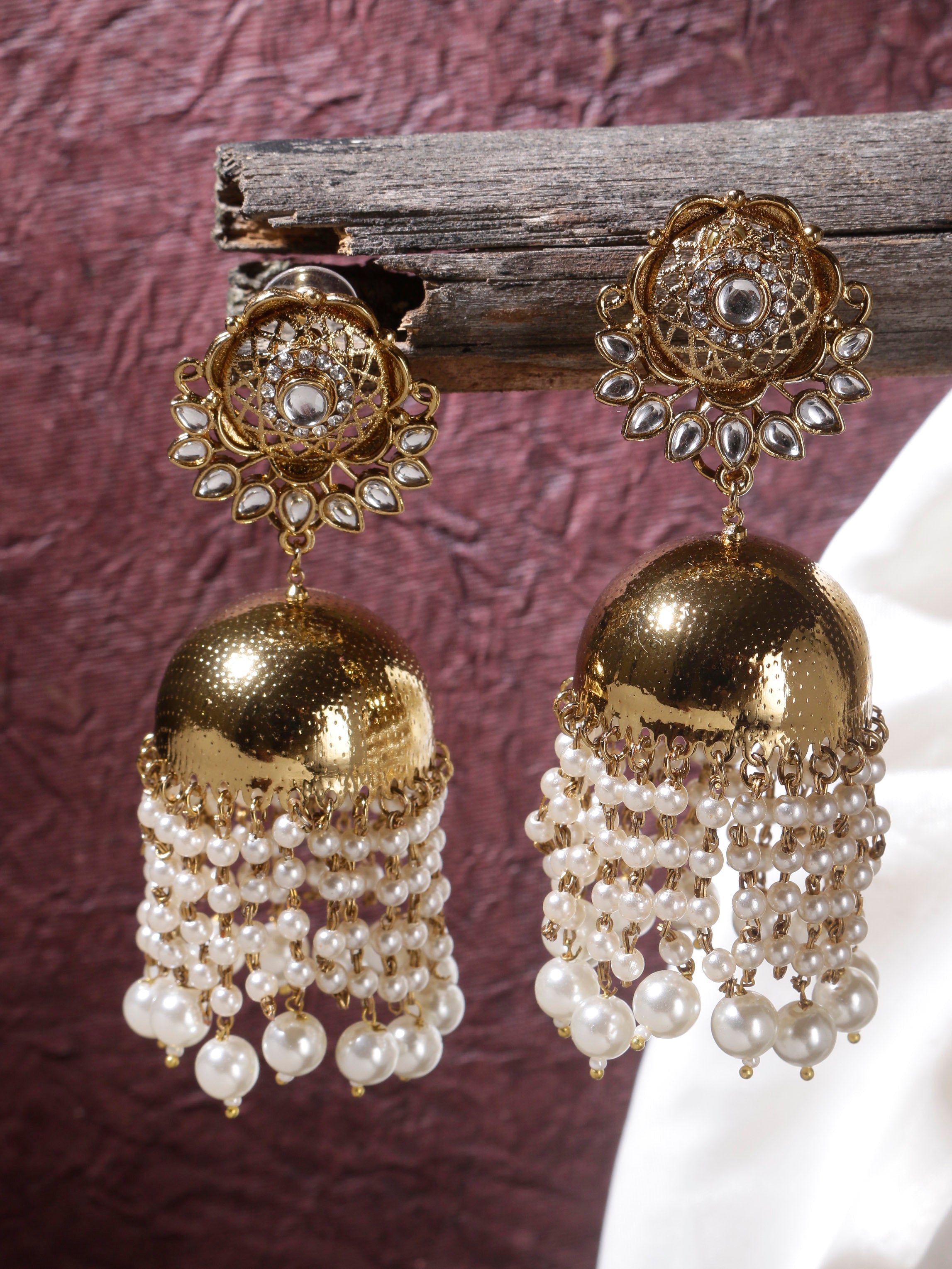 Swisni Alloy Golden Jhumki Earrings with White Beads