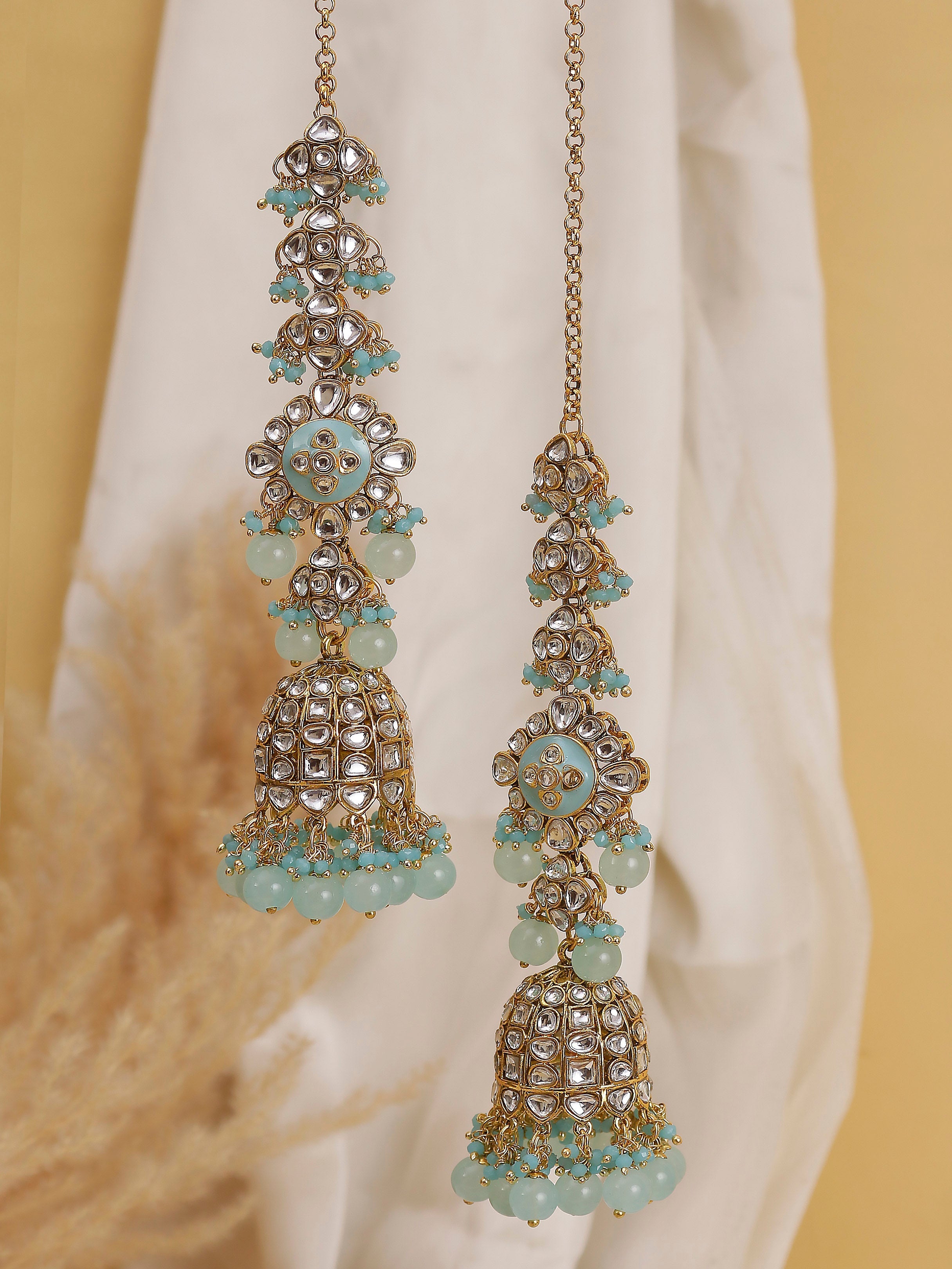 Swisni Alloy Golden Jhumki Earrings with Firozi Beads