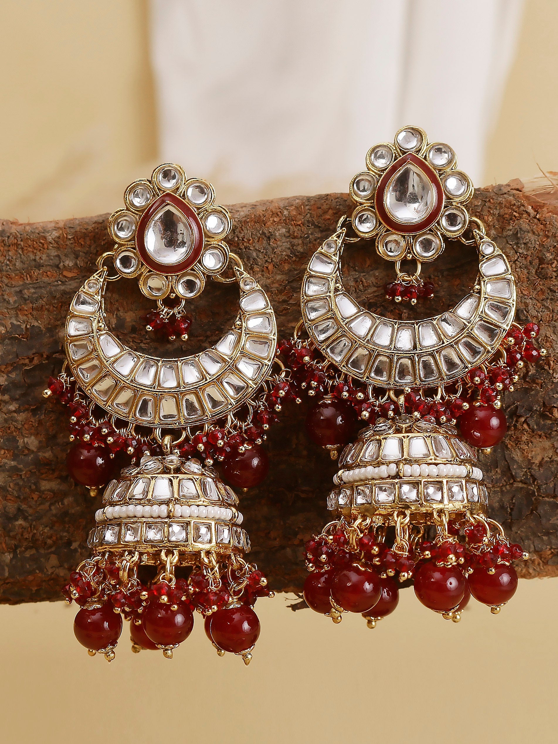 Swisni Alloy Golden Jhumki Earrings with Maroon Beads