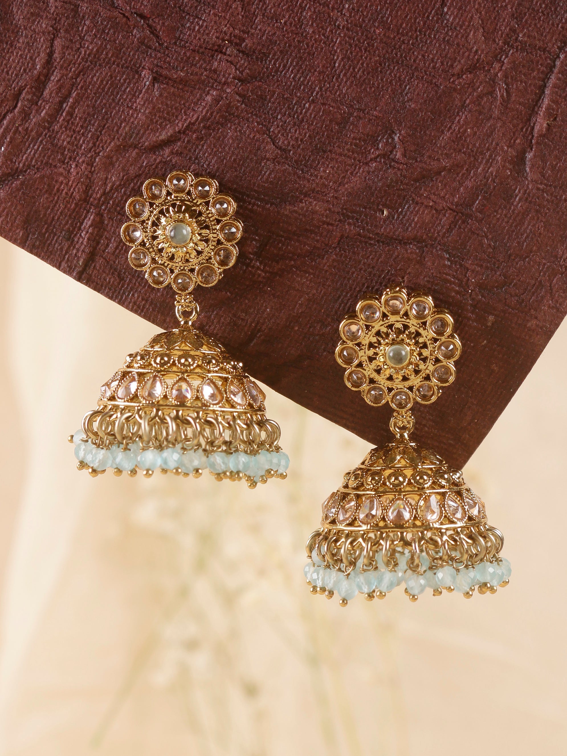 Swisni Alloy Golden Jhumki Earrings with Mint Beads