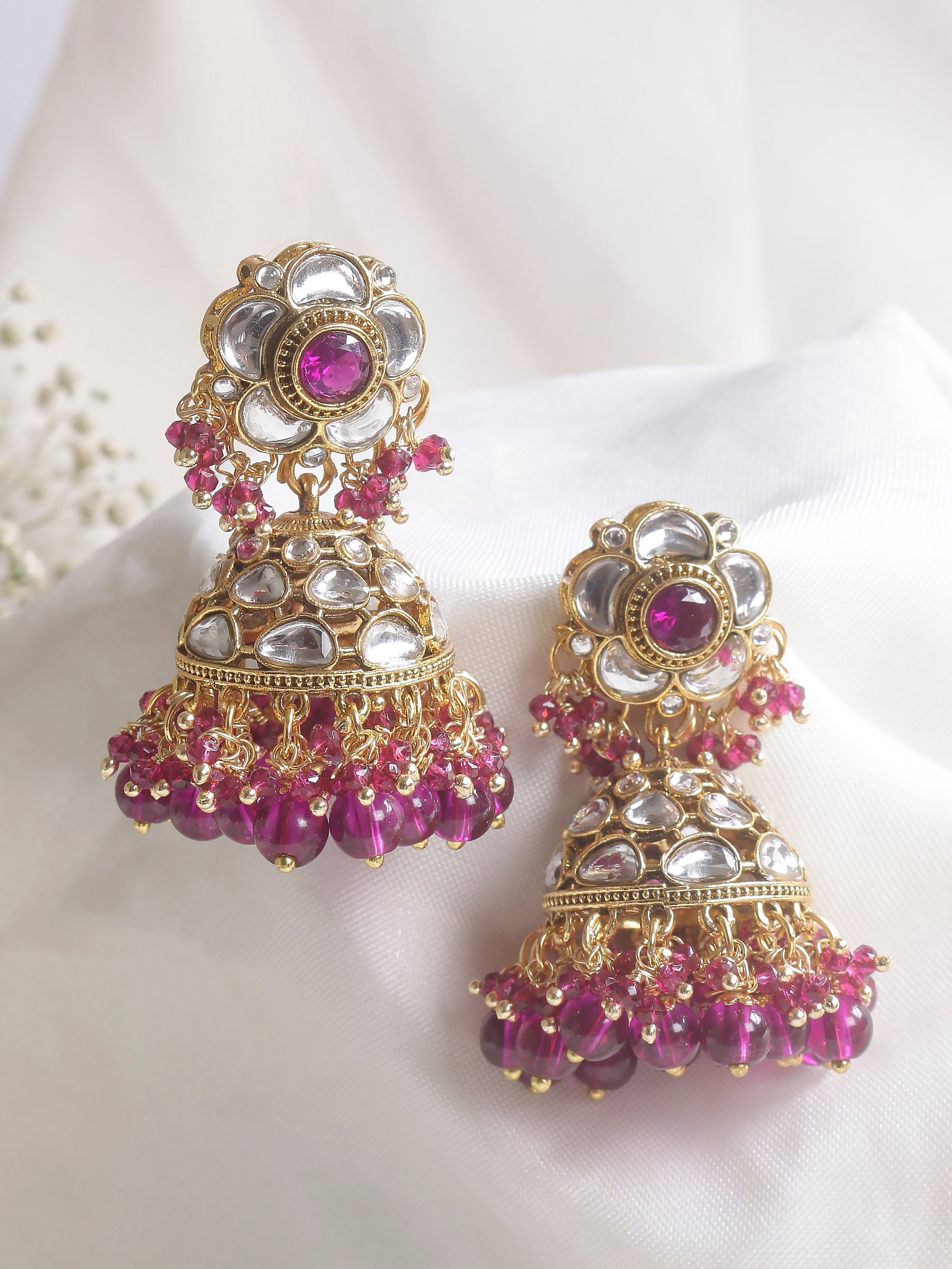 Swisni Alloy Golden Jhumki Earrings with Perple Beads