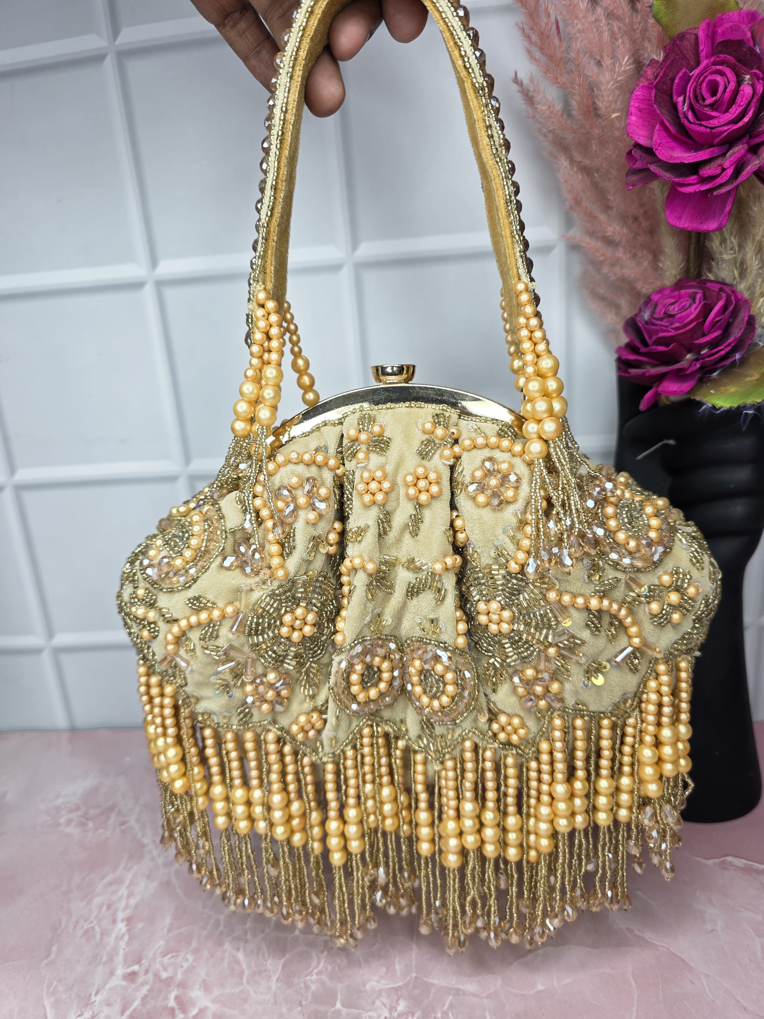 Golden batua bag
