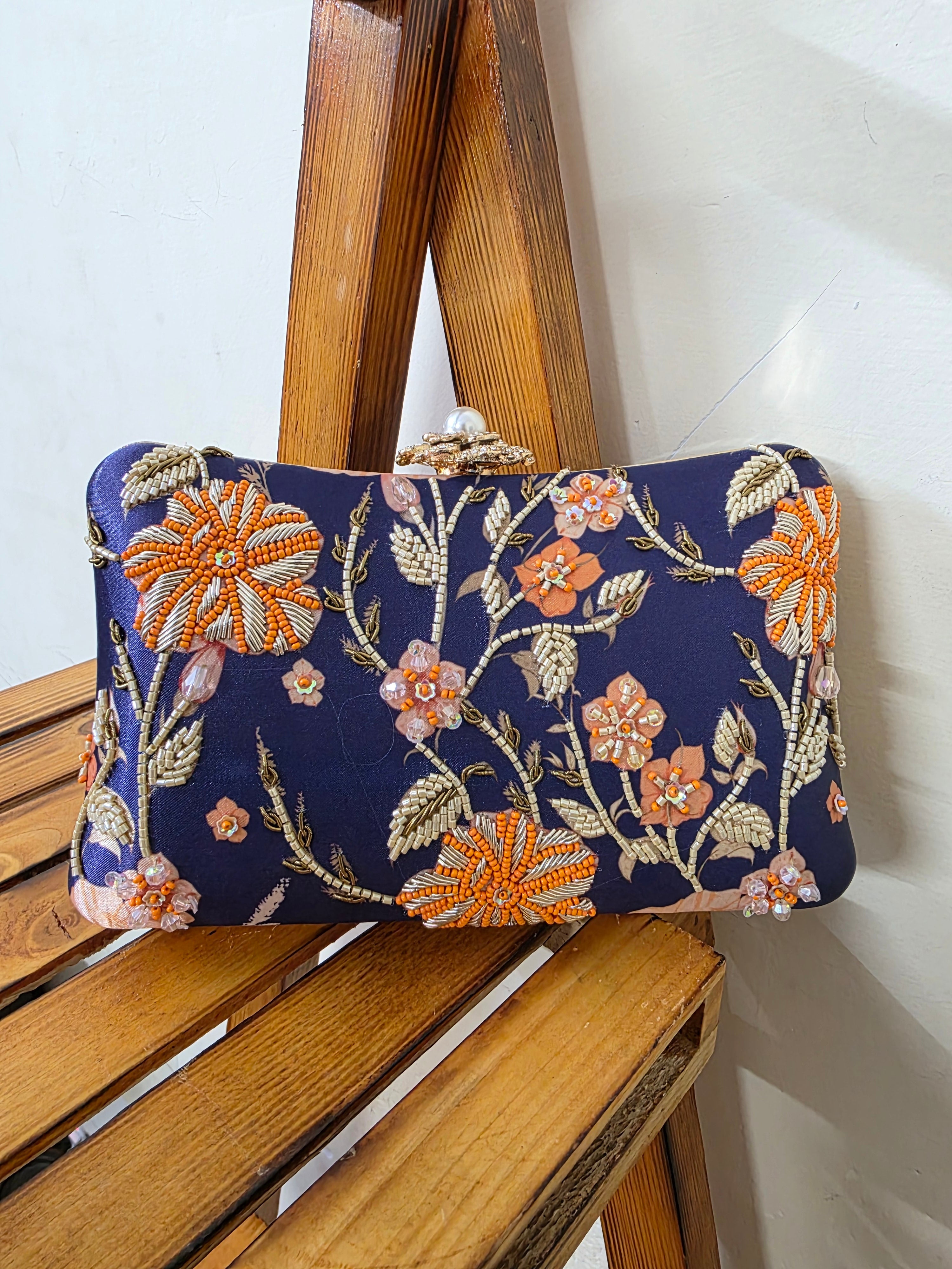 Printed embroidered clutch bag