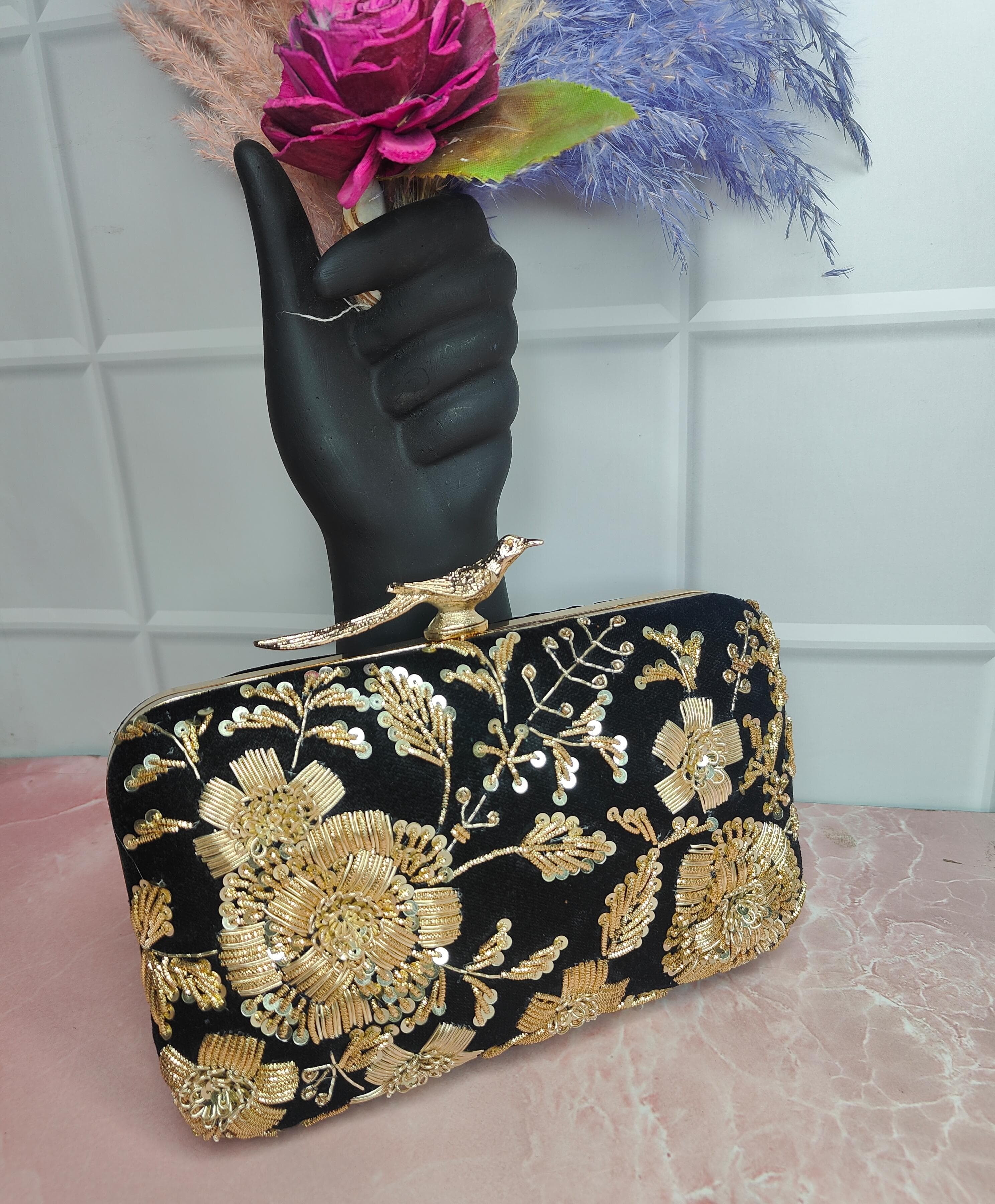 Black embroidered clutch bag with bird lock