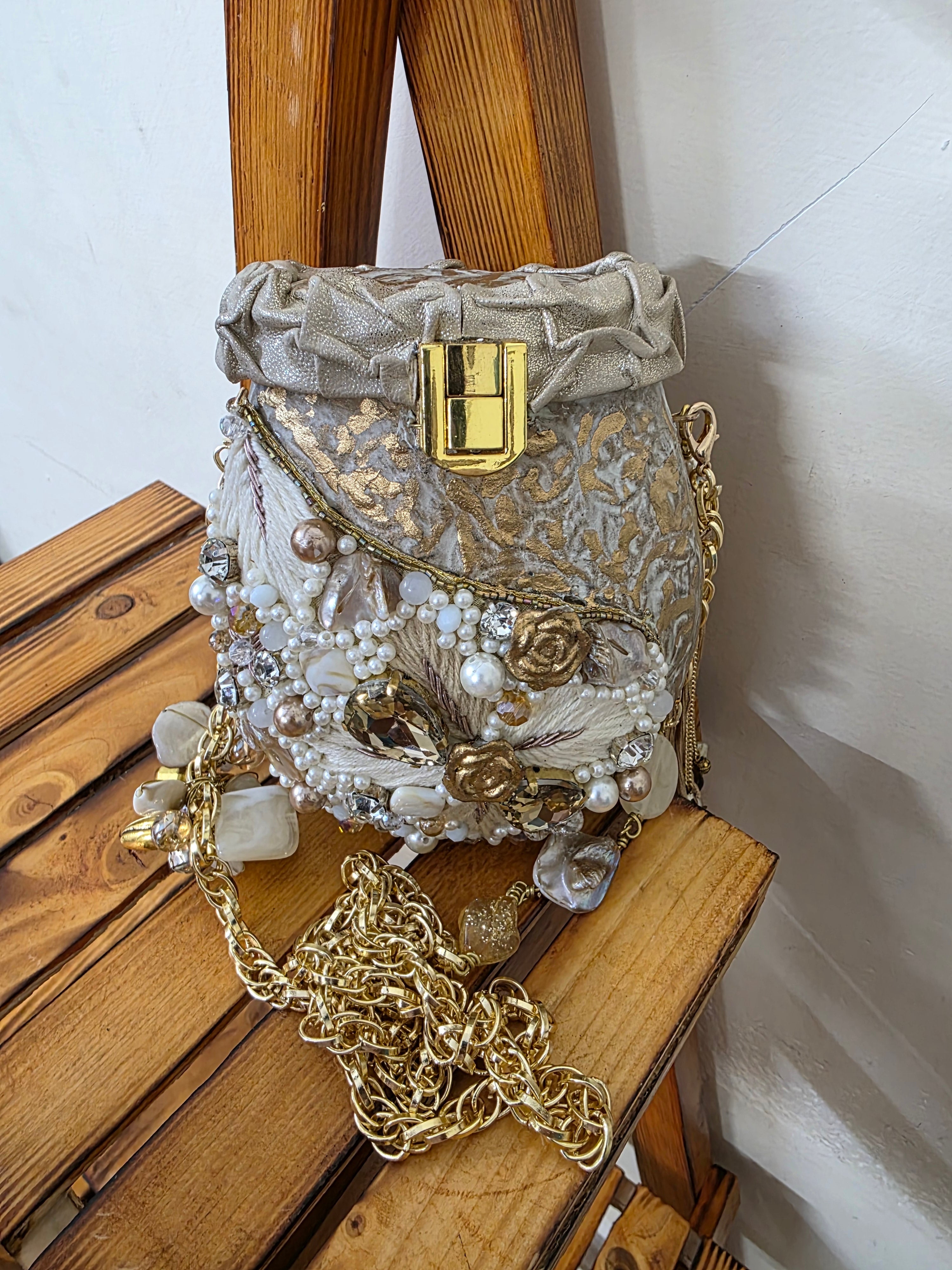 Brass Heavy clutch bag with embroidered