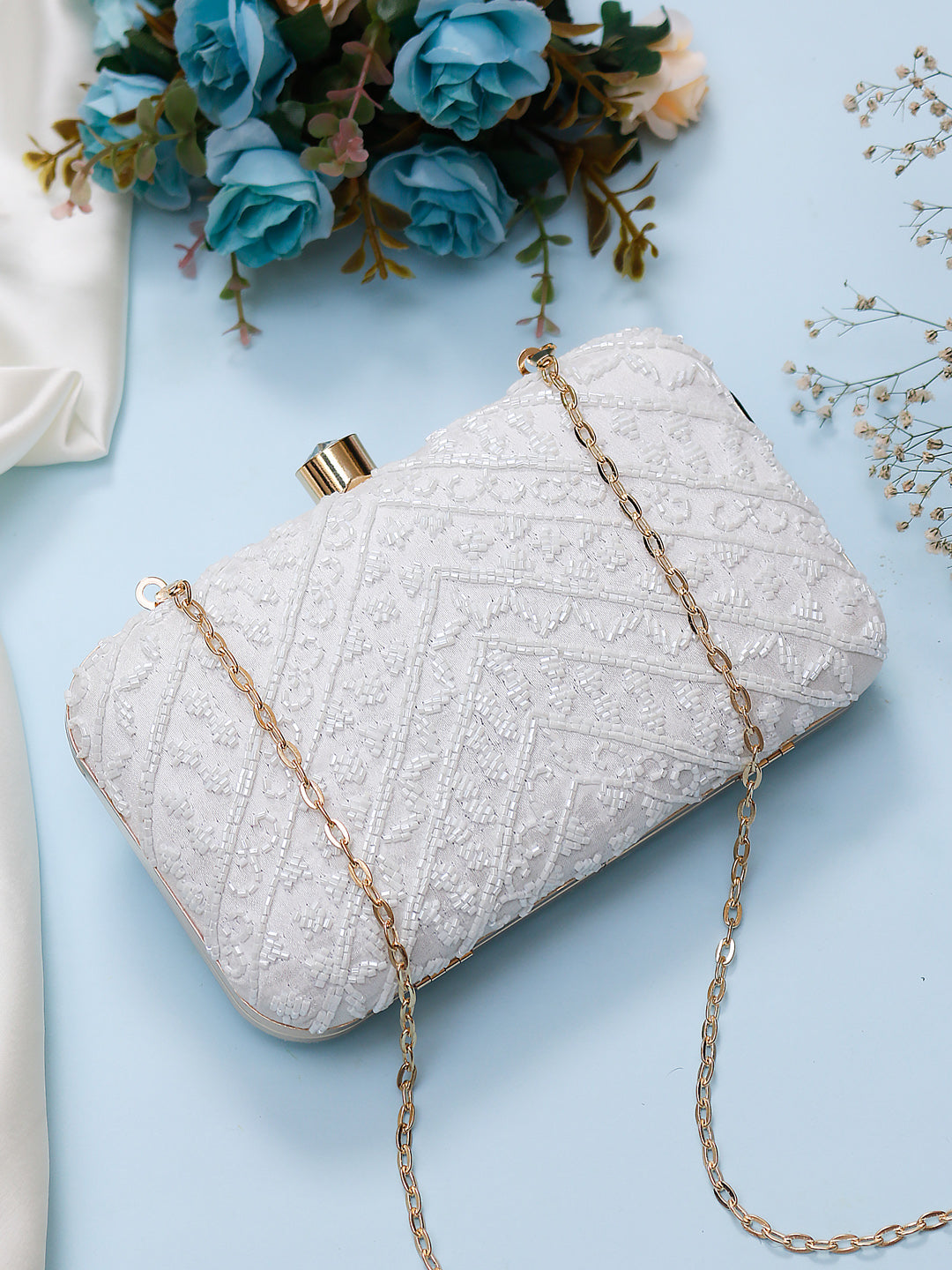 embroidered white clutch