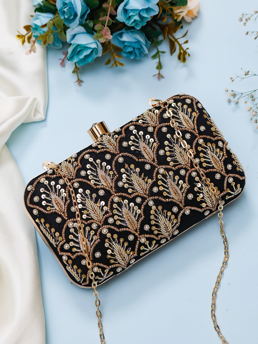 embroidered black clutch